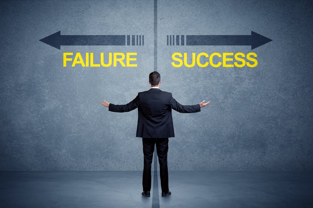 Businessman standing in front of success and failure arrow concept on grungy background