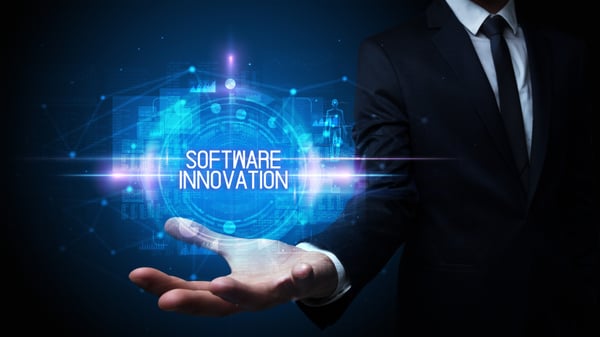 Man hand holding SOFTWARE INNOVATION inscription, technology concept